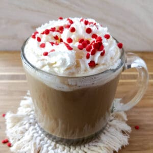 Sugar cookie latte with red sprinkles.