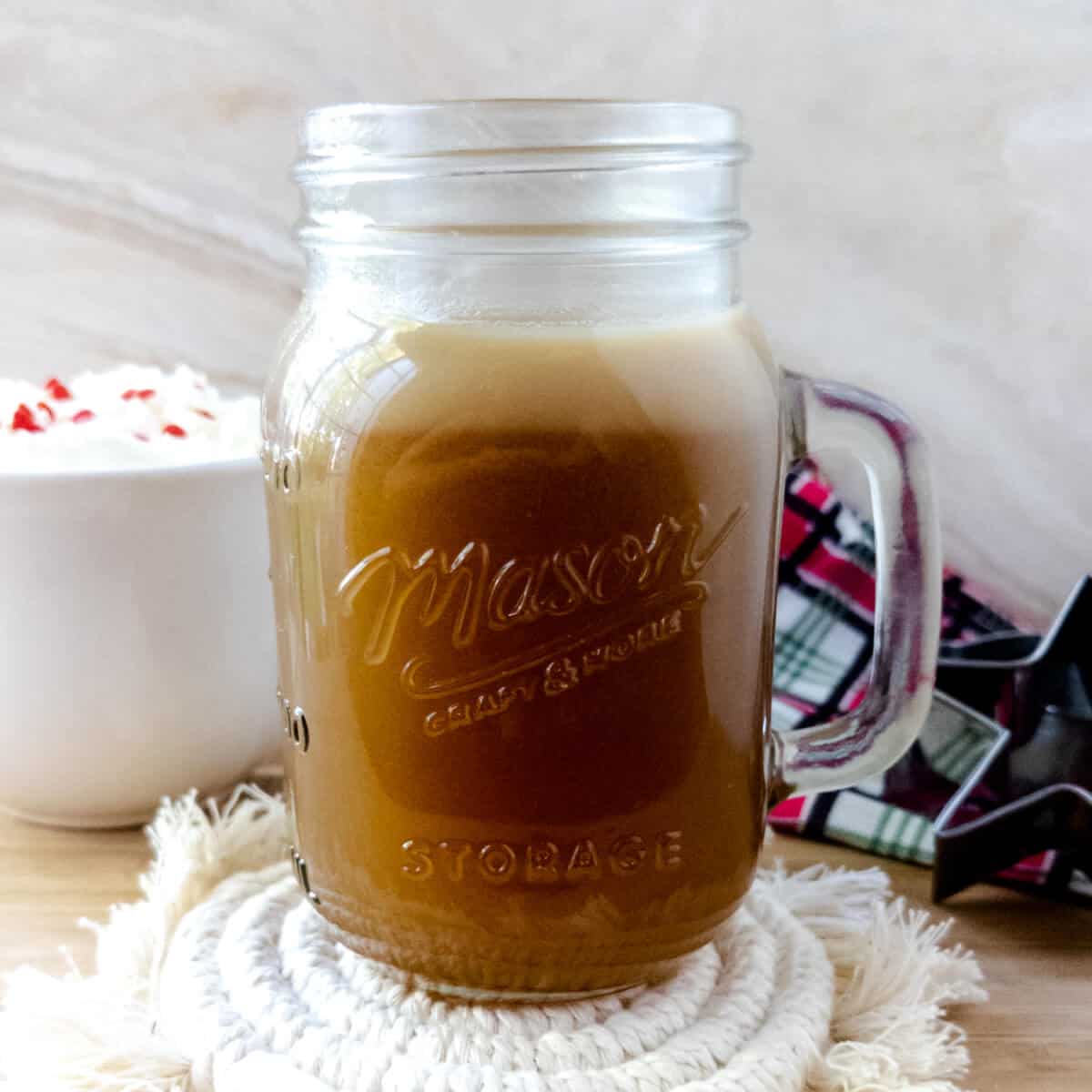 Sugar cookie flavored simple syrup in a small mason jar.