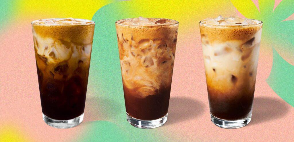 Three of Starbucks shaken espressos in glass cups.